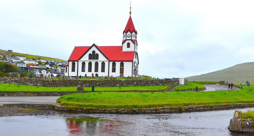 image of Faroe sandavagur church in the valley of the witch